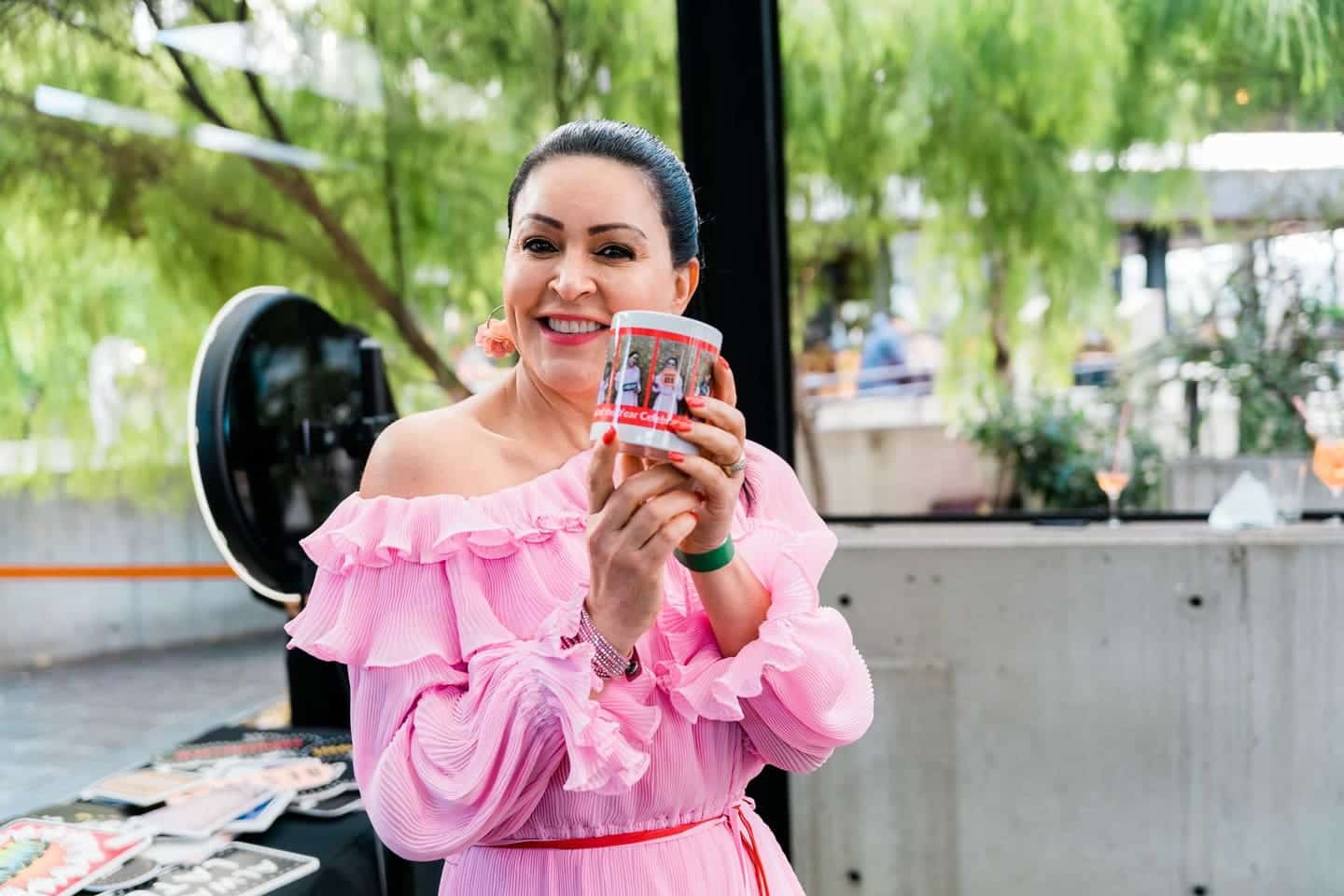 Guest holding a printed photo mug